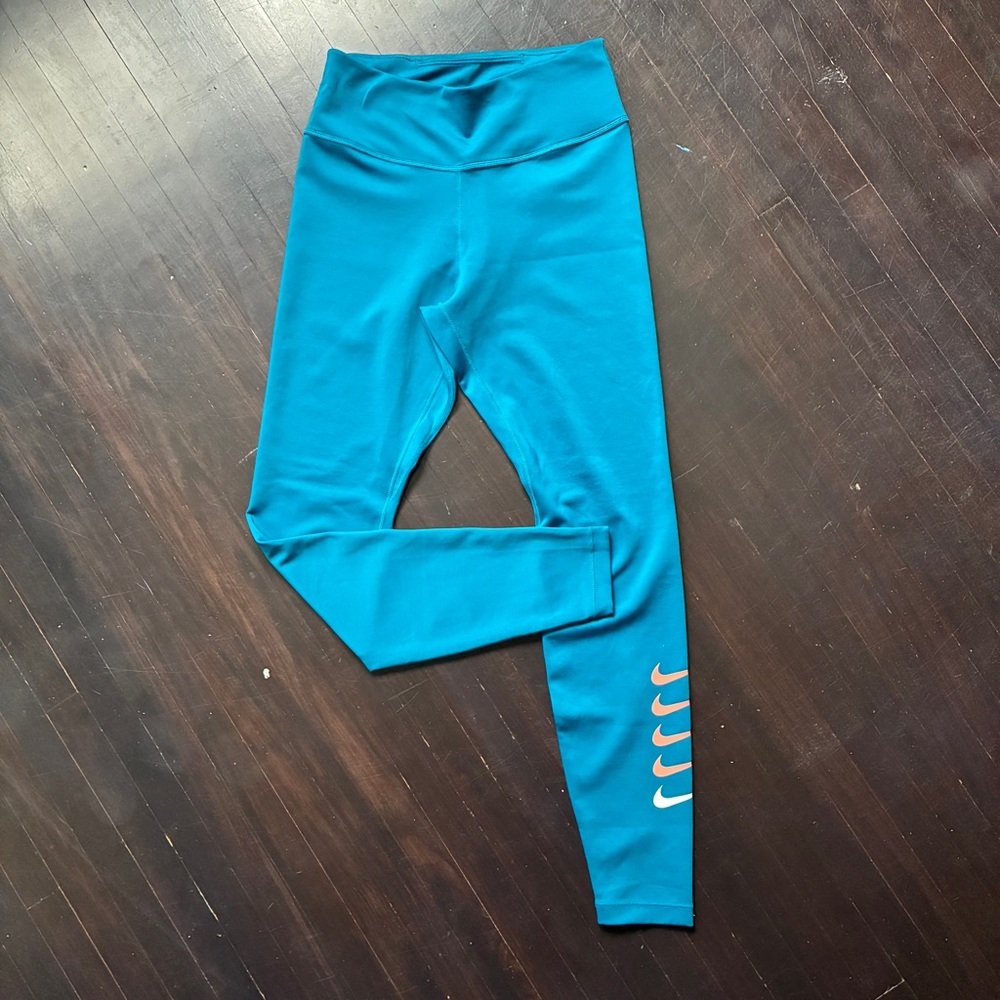 Nike women’s Teal/turqouise Leggings with Multi Swoosh Detail, size small